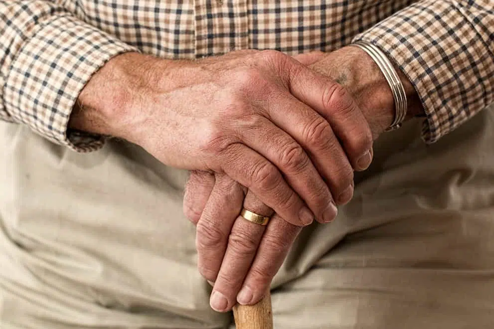 An image a older man's hand holding a cane to represent "Elder & Special Needs Law Services in Waynesville NC" symbolically